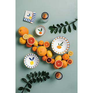 Decorative plates with fruit designs on a green background
