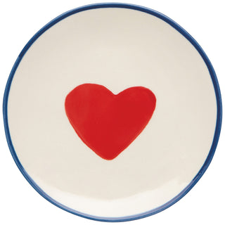 Ceramic plate with a red heart on a white background