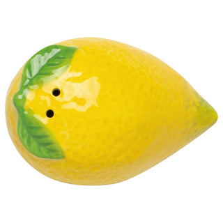Yellow lemon-shaped pepper shaker with a green leaf on a white background