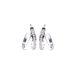 Silver hoop earrings with embedded stones on a white background