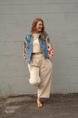 Women wearing a matching lounge set and a crochet  sleeve denim jacket.