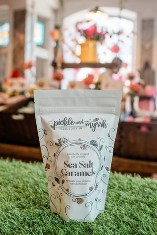 Packaging of Sea Salt Caramels with decorative design on a grassy surface