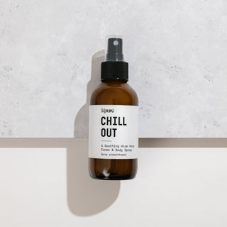 Brown spray bottle labeled 'Chill Out' on a light gray background