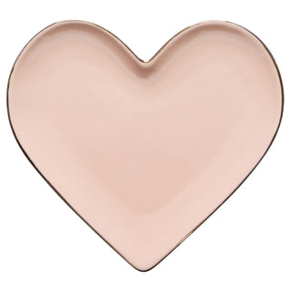 Heart-shaped pink plate on a white background