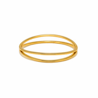 Gold bangle on a white background