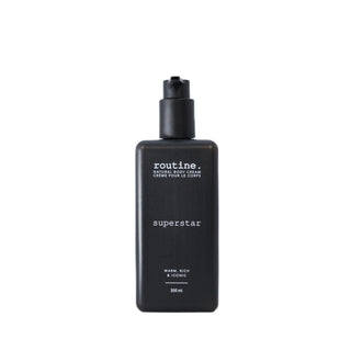 Black bottle of 'routine.' superstar body cream on a white background
