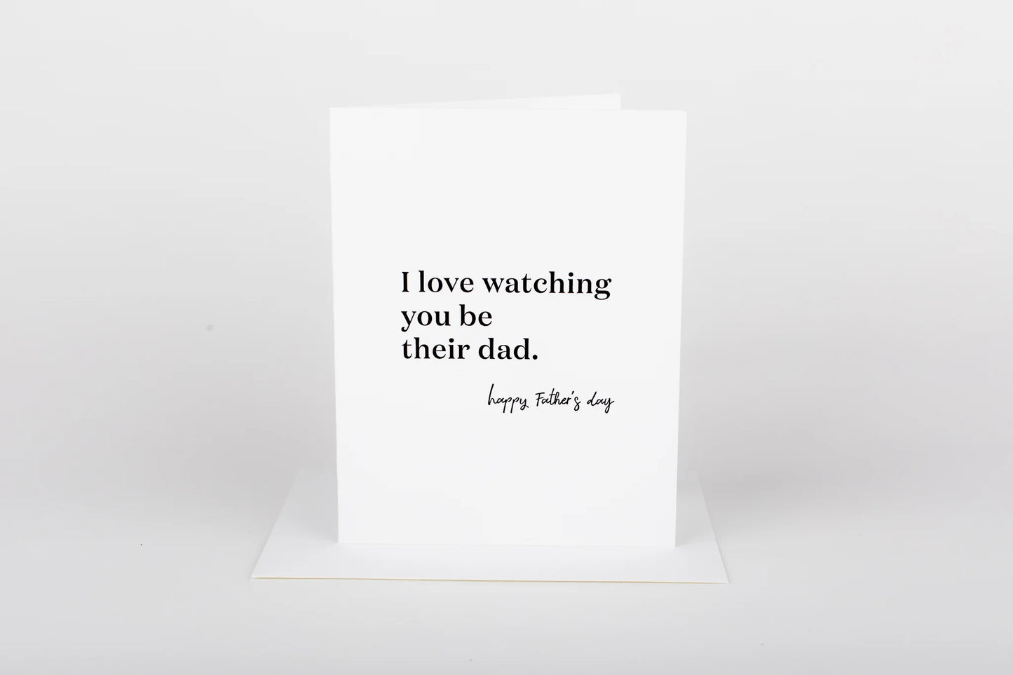 Greeting card with text 'I love watching you be their dad. Happy Father's Day' on a white background