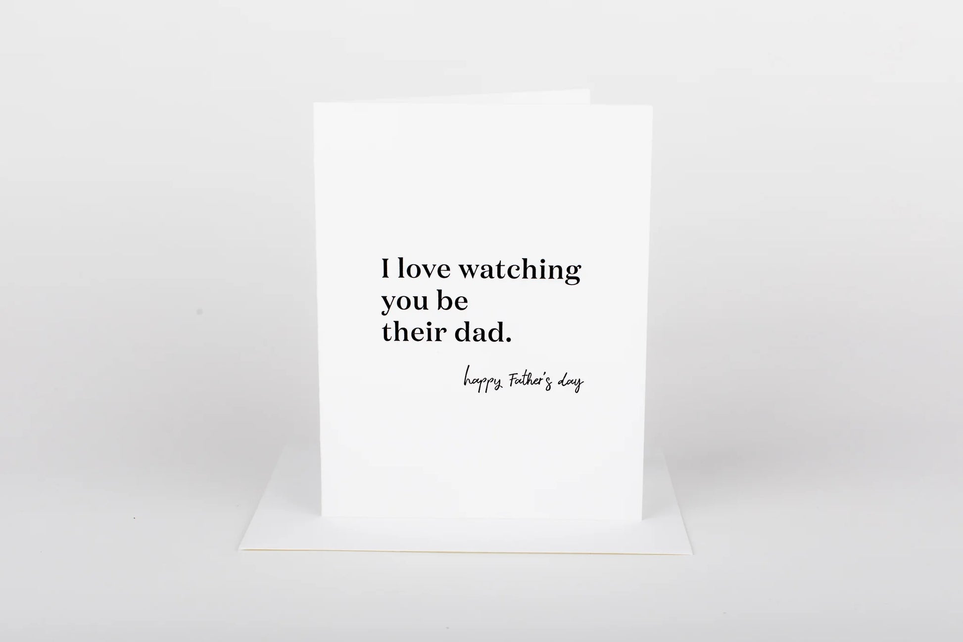 Greeting card with text 'I love watching you be their dad. Happy Father's Day' on a white background