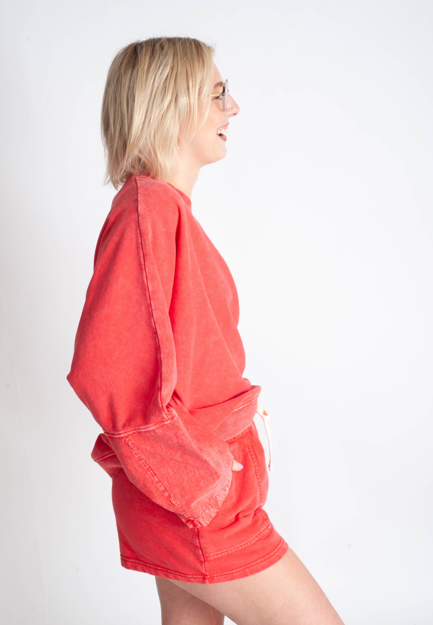 Woman wearing a red outfit on a white background
