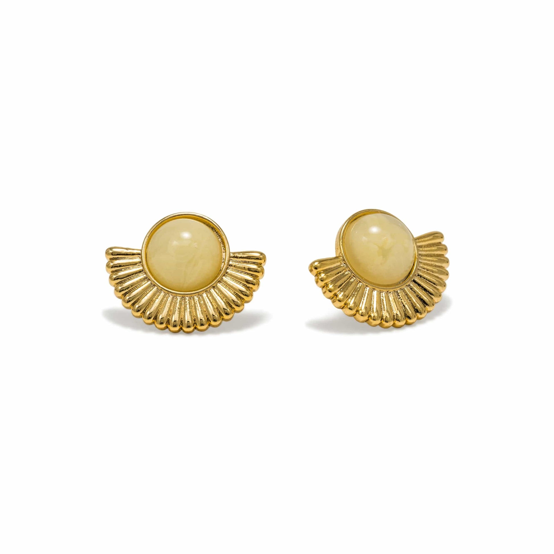 Pair of gold earrings with beige centers on a white background