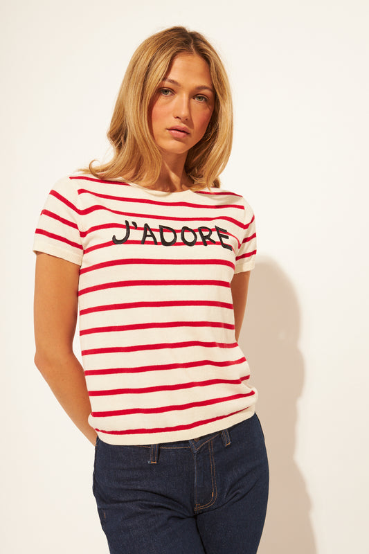 Woman wearing a red and white striped t-shirt with 'J'adore' text on a plain background