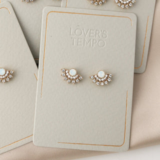 fan stud earrings on a lover's tempo branded card