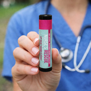 Person holding a 'Nurse's Rescue' lip balm with a blurred background