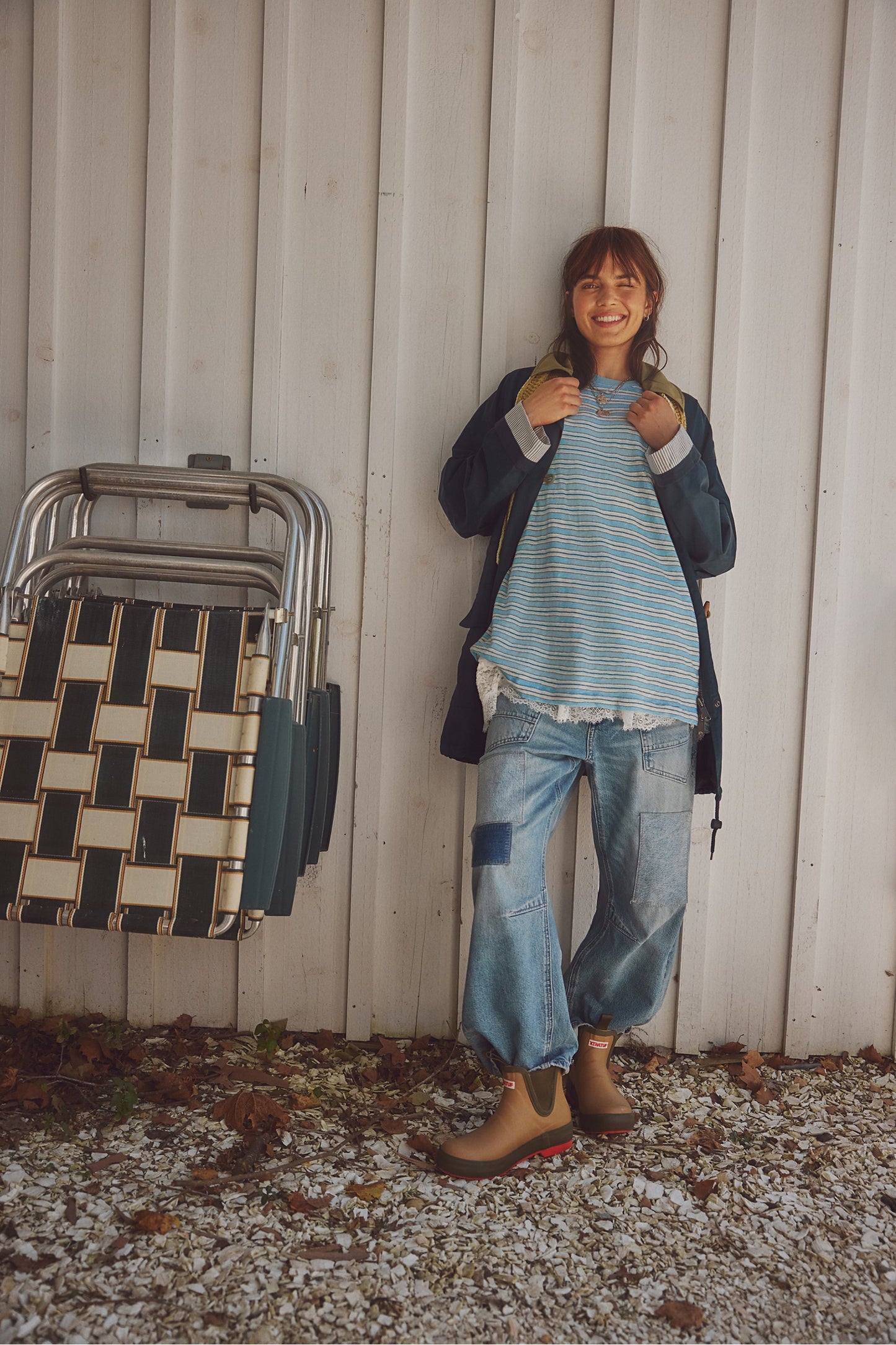 Woman wearing a striped shirt from free people outside