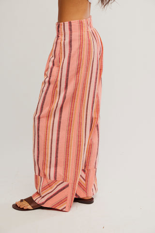 Striped wide-leg pants worn by a person on a white background
