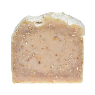 an oatmeal and almond soap on a white background.