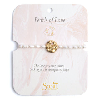 Pearl bracelet on a 'Pearls of Love' Scout branded card with shell charm.