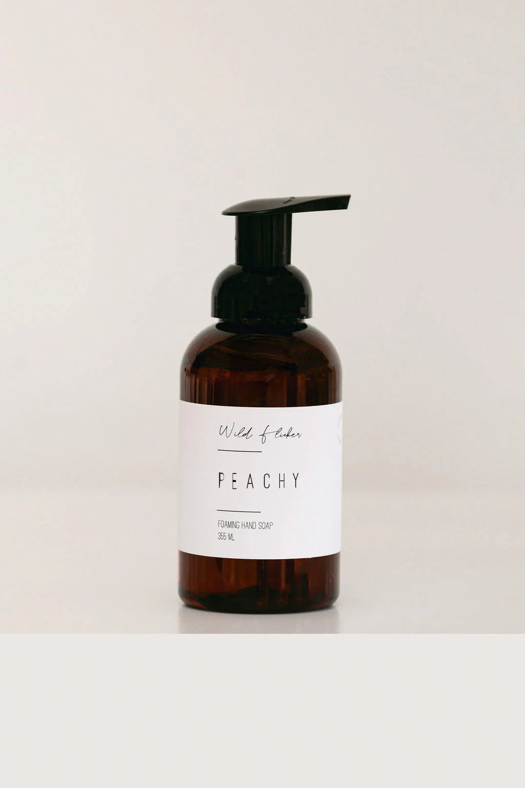 Peachy hand soap in a photo studio