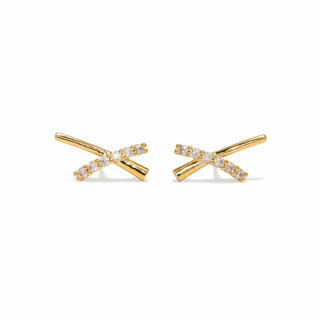 Gold cross-shaped earrings with clear stones on a white background