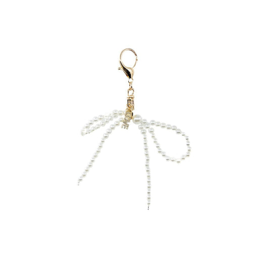 Gold and silver earring on a white background
