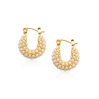 pearl and gold hoop earrings on a white background