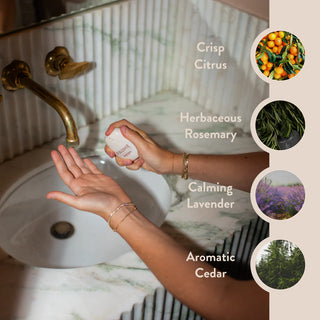 Paume hand sanitizer mist on a neutral background.