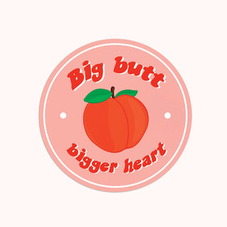 A sticker with the phrase "Big butt, Bigger Heart"