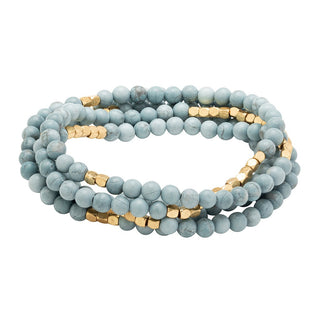 a beaded crystal wrap bracelet of necklace on a white background