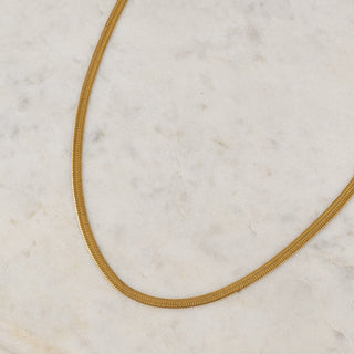 close up of a gold chain necklace
