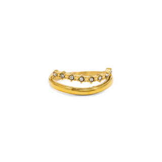A gold ring with a double-band design, featuring a top band adorned with small star-shaped settings holding clear round gemstones, shown on a plain white background.