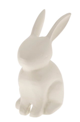 White ceramic rabbit figurine on a white background