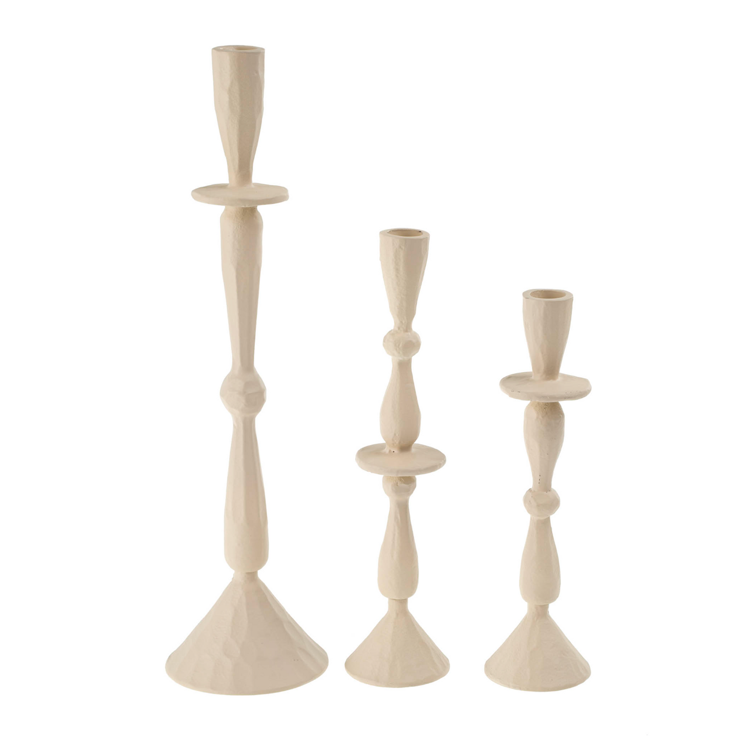 Three beige candle holders of different heights on a white background