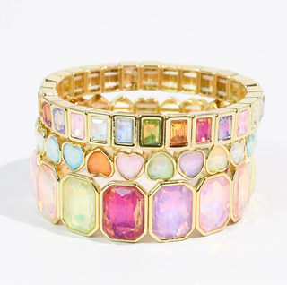 A bright colourful bracelet stack.