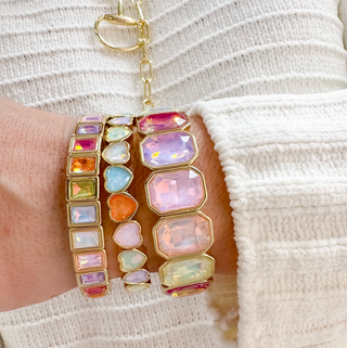 A bright colourful bracelet stack.