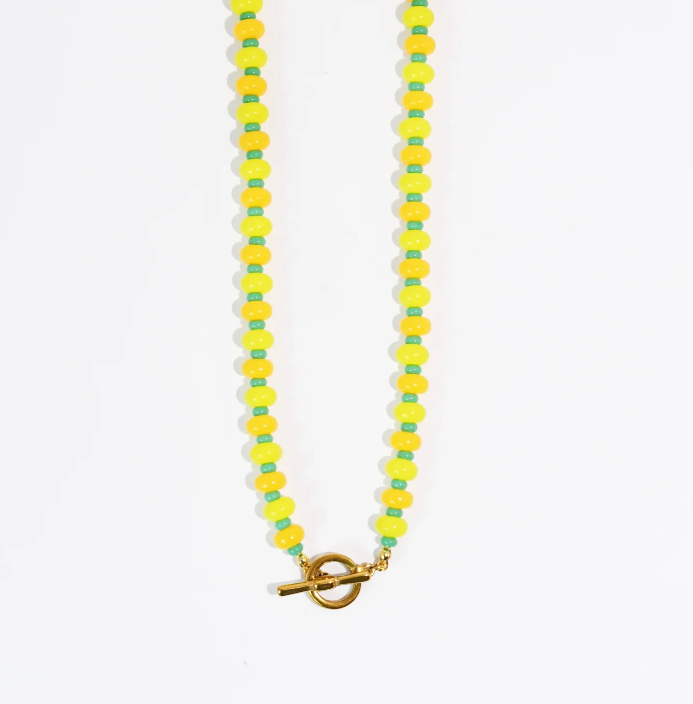A Yellow & Green beaded necklace against a white background.