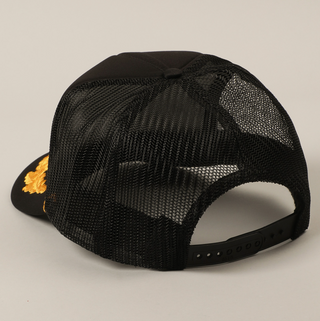 Black mesh cap with a gold logo on a light gray background