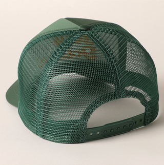 Green mesh cap on a light beige background
