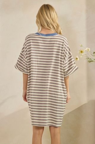 Women wearing a striped t-shirt dress against a neutral background.