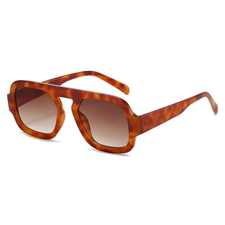 A pair of retro-inspired Aviator sunglasses with a patterned frame and orange lenses.