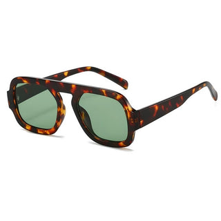 A pair of retro-inspired Aviator sunglasses with a patterned frame and green lenses.