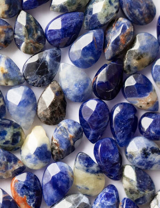 Collection of multicolored stones on a white background
