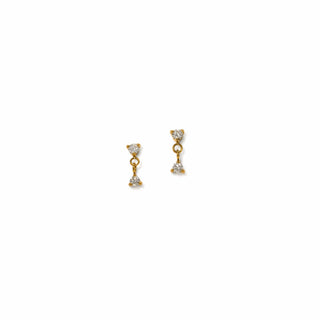 Gold earring with diamonds on a white background