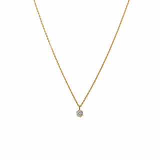 Gold necklace with a small diamond pendant on a white background