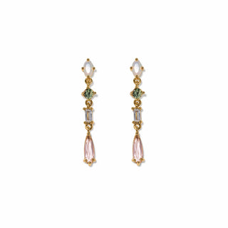 Pair of gold earrings with pink and green gemstones on a white background