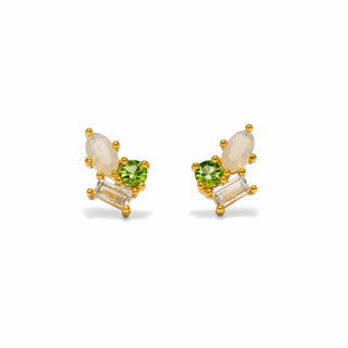 Pair of earrings with green gemstones and gold accents on a white background