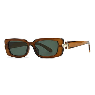 A pair of Stella sunglasses with brown sheer frames, green tinted lenses, and gold hardware.