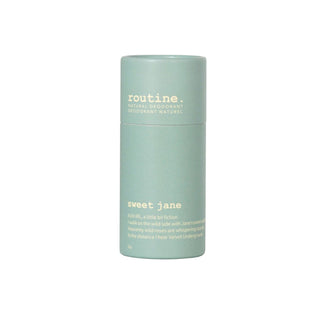 A stick of 'Sweet Jane' deodorant by Routine, in a light blue cylindrical container with a teal lid.