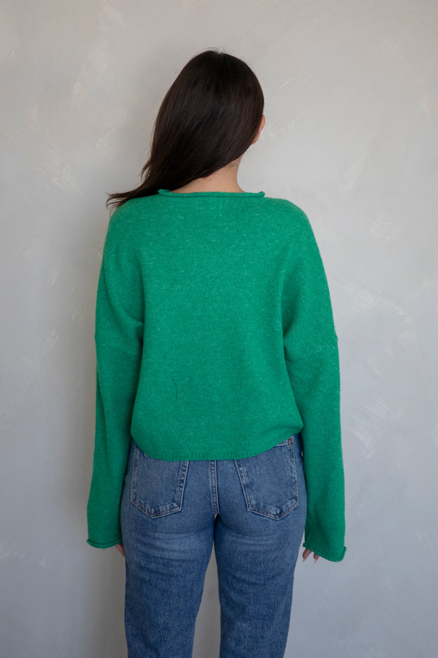 women wearing a long sleeve green cardigan.
