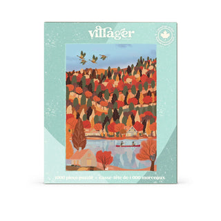 A 1000-piece jigsaw puzzle box by Villager, featuring a colorful illustration of a Canadian autumn landscape with red and orange trees, a blue lake, and a canoe on the front.
