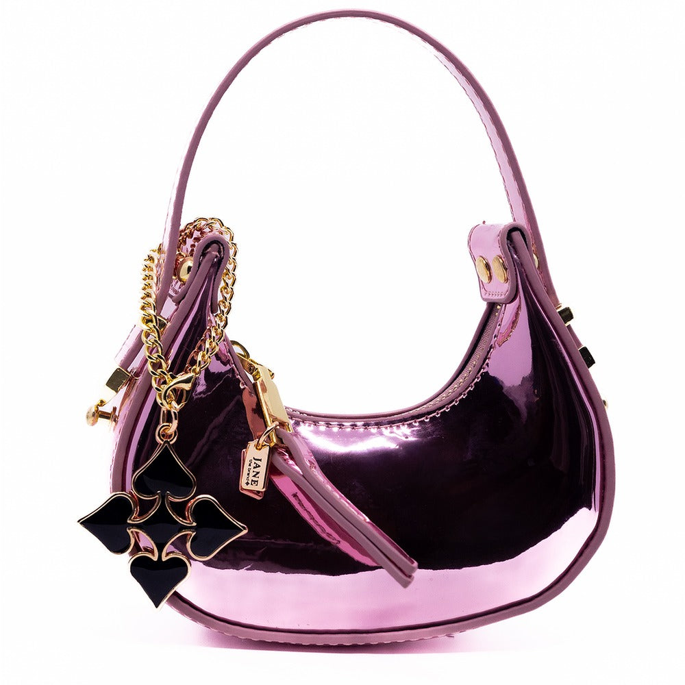 Pink handbag with gold chain and bow charm on a white background
